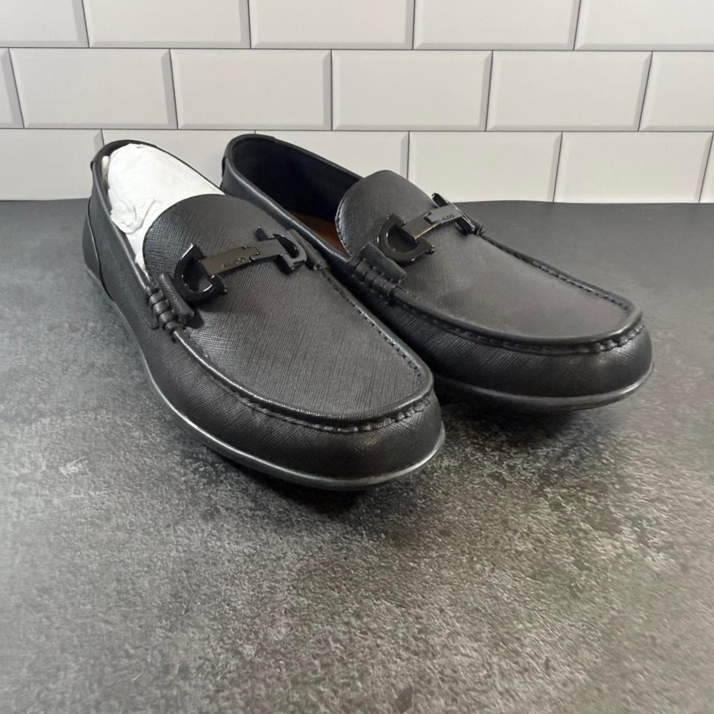 Aldo black leather loafers with silver buckle detail. Size US 7